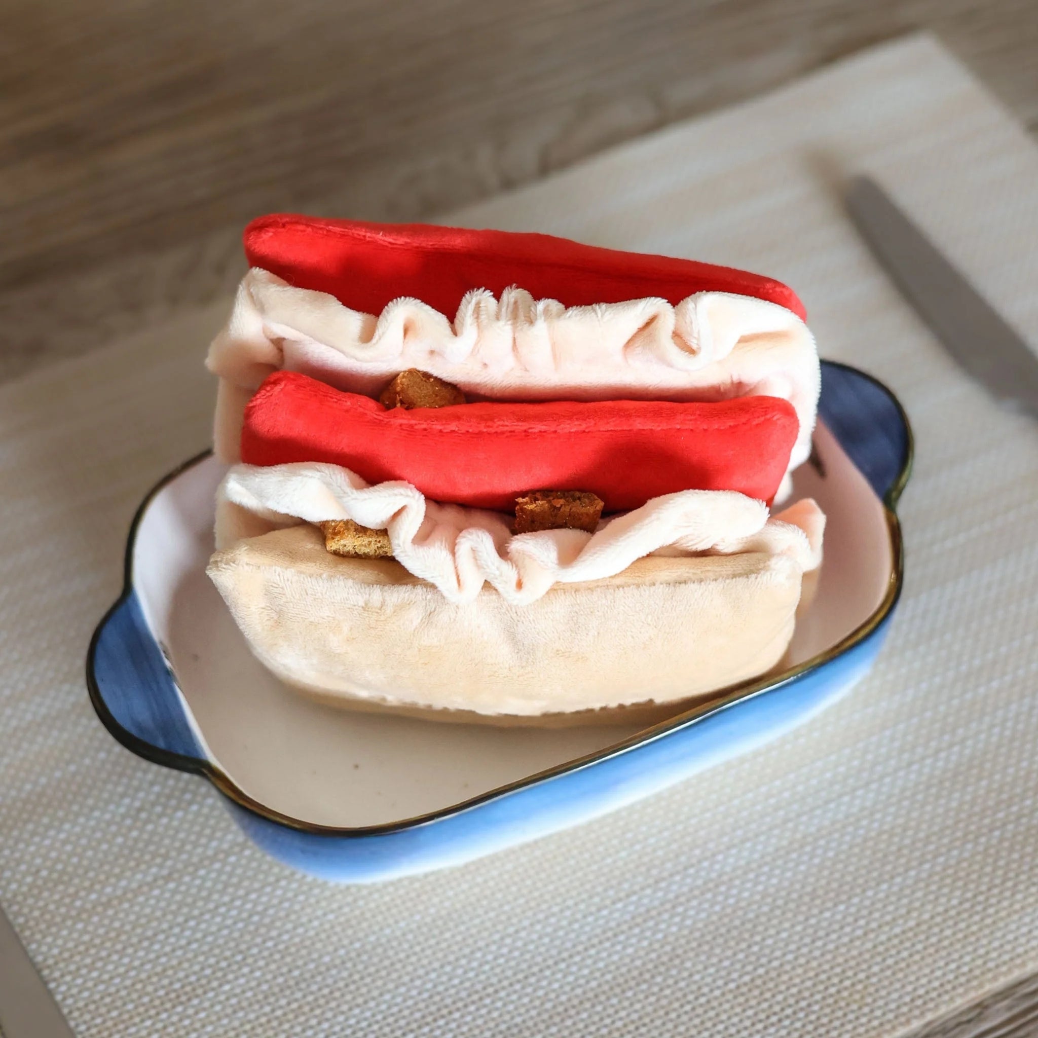Close-up of hidden treat pockets filled with kibble inside a dog slow feeder mat to help slow down fast eaters.
