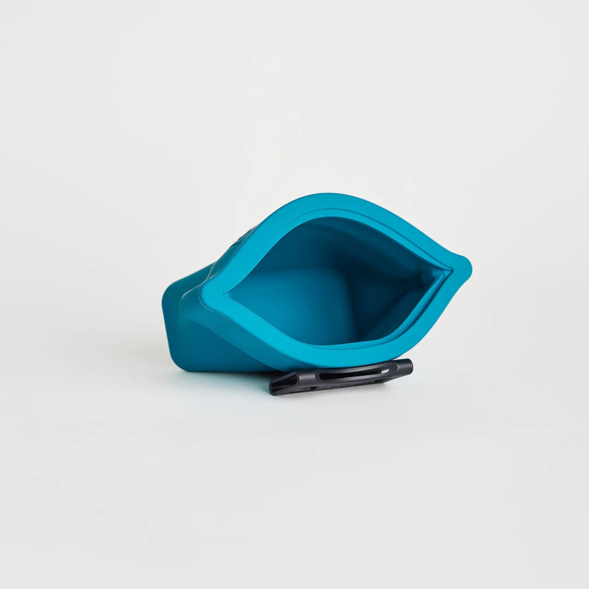 An open turquoise silicone dog treat pouch, the Ultimate Treat Pouch The Mini by Voilapets, showing its wide mouth and interior with a black belt clip on a white background.