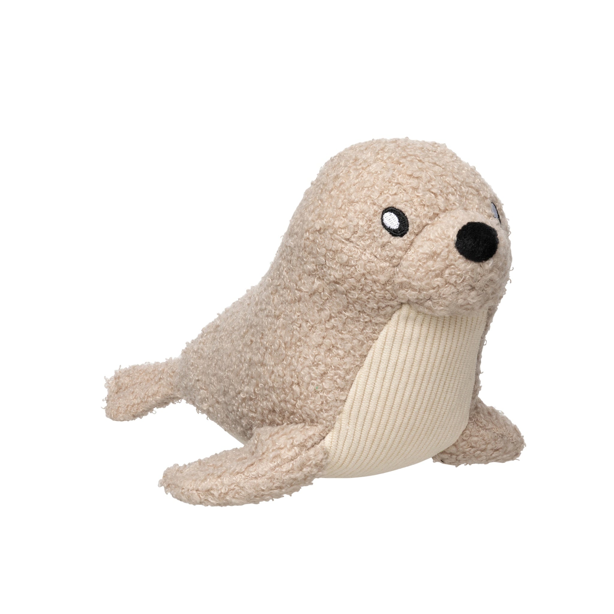 A side profile view of the FuzzYard Life Sandstone Seal plush dog toy against a white background, highlighting its beige boucle textured body, black plush nose, and cream corduroy chest panel.