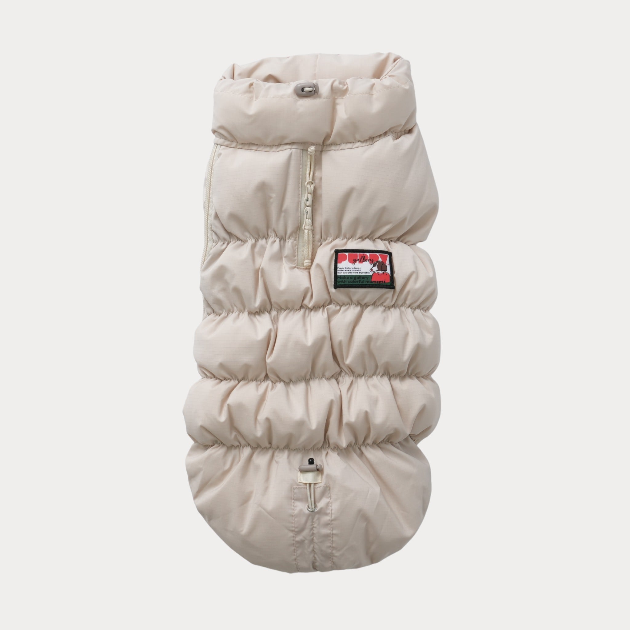 A top-down product shot of the beige Kiroro 2.0 Cloud Padding Vest, displaying the full-length back zipper, waterproof harness opening, and adjustable toggle drawstrings.