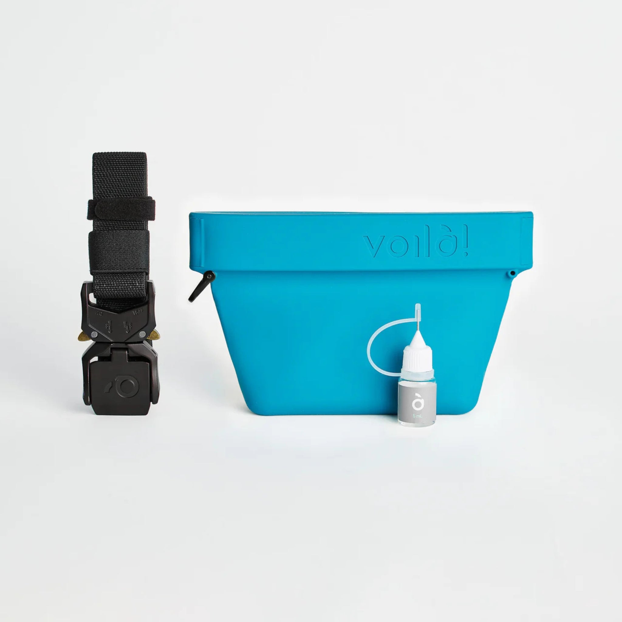 The complete Voilapets Ultimate Treat Pouch The Mini kit in turquoise, including the silicone dog treat bag, heavy-duty black buckle belt, and a small maintenance oil bottle.